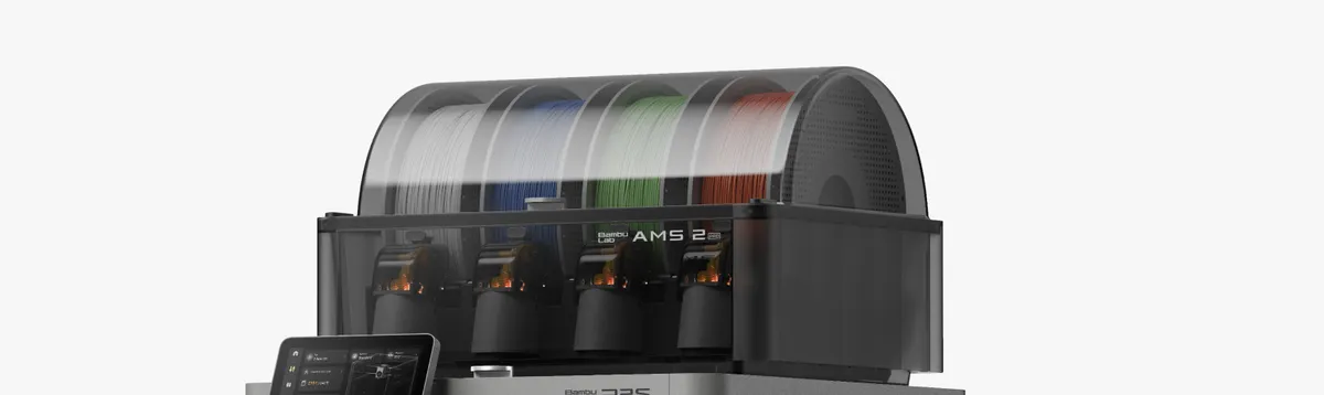AMS 2 Pro multi-material unit with four filament spools visible under its transparent cover